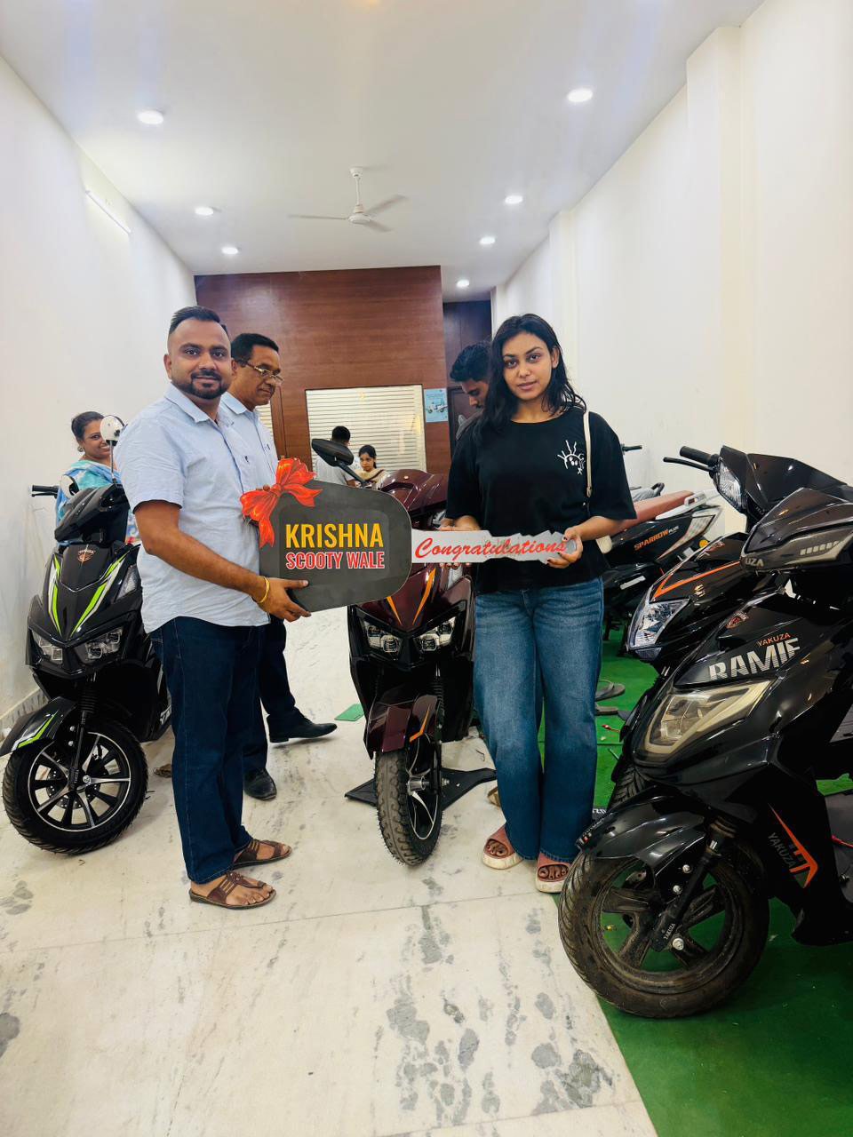 Krishna Scooty Wale team with a customer in Mohali
